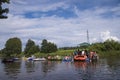 Unidentified people drafting down the river at the Kaljakellunta (Beer Floating) festival Royalty Free Stock Photo